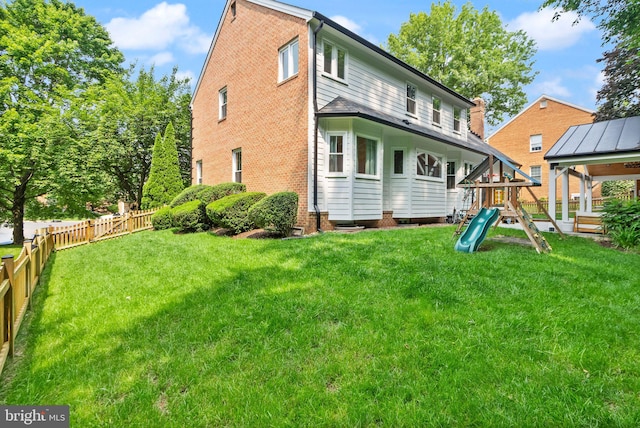 10000 Manor Pl, Fairfax, VA 22032 - rear view of house with a playground and brick siding
