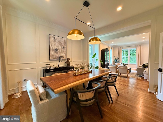 10000 Manor Pl, Fairfax, VA 22032 - dining space with a decorative wall, ornamental molding, arched walkways, wood finished floors, and recessed lighting