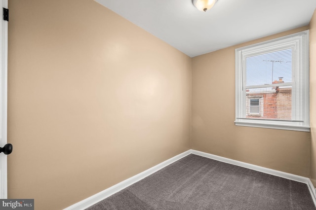 4528 Tudor St, Philadelphia, PA 19136 - empty room featuring baseboards and dark carpet