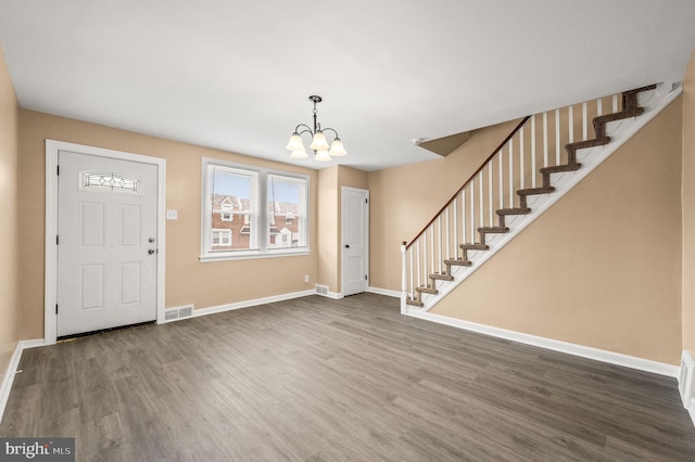 4528 Tudor St, Philadelphia, PA 19136 - foyer featuring wood finished floors, a chandelier, stairway, and baseboards