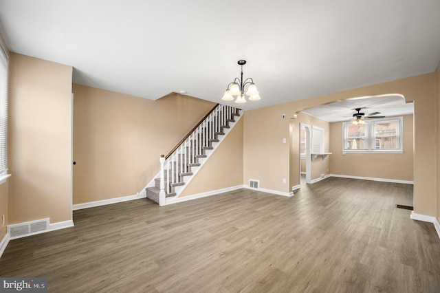 4528 Tudor St, Philadelphia, PA 19136 - unfurnished living room with arched walkways, wood finished floors, baseboards, and ceiling fan