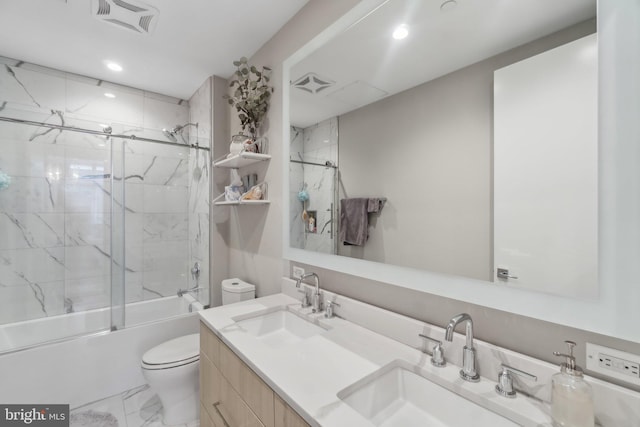 646 H St NE Unit 405, Washington, DC 20002 - full bathroom with toilet, combined bath / shower with glass door, double vanity, marble look tiles, and recessed lighting