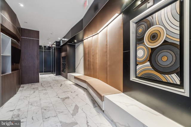 646 H St NE Unit 405, Washington, DC 20002 - hallway featuring light marble finish floors and recessed lighting