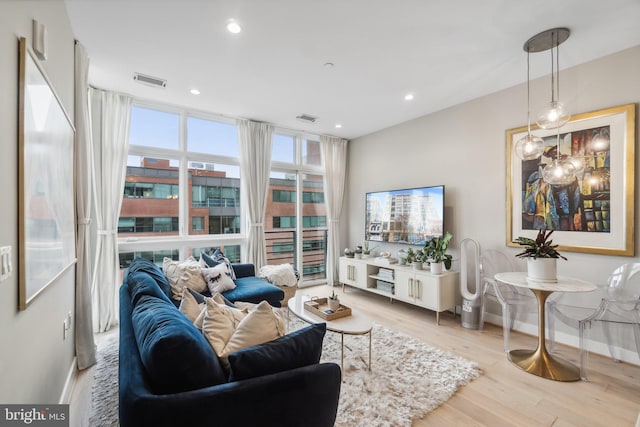 646 H St NE Unit 405, Washington, DC 20002 - living room featuring baseboards, wood finished floors, and recessed lighting