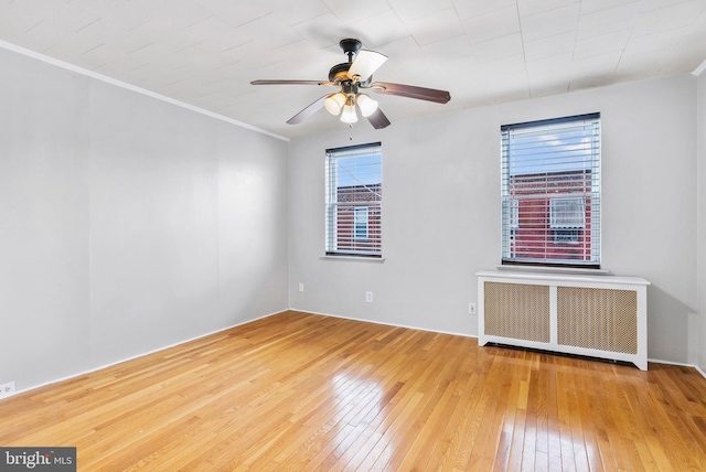 1936 S Sartain St, Philadelphia, PA 19148 - spare room with radiator, hardwood / wood-style flooring, a ceiling fan, and crown molding