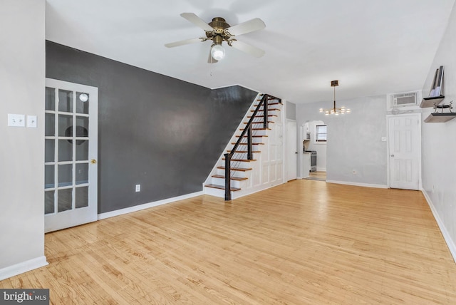 1936 S Sartain St, Philadelphia, PA 19148 - unfurnished living room featuring stairway, wood finished floors, a chandelier, ceiling fan, and baseboards