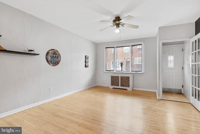 1936 S Sartain St, Philadelphia, PA 19148 - foyer featuring radiator heating unit, wood finished floors, a ceiling fan, and baseboards