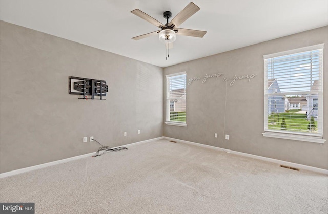 25040 Treeview Ln, Lewes, DE 19958 - carpeted spare room featuring plenty of natural light, ceiling fan, and baseboards