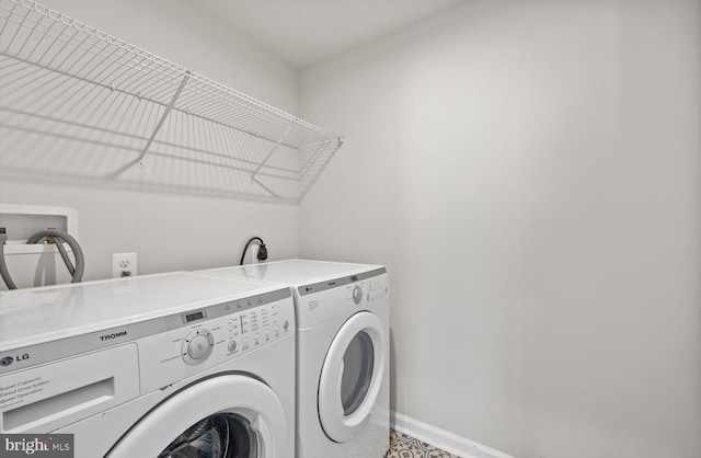 25040 Treeview Ln, Lewes, DE 19958 - laundry area with washer and dryer and baseboards