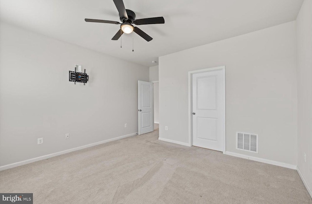 25040 Treeview Ln, Lewes, DE 19958 - unfurnished bedroom featuring light carpet, baseboards, and a ceiling fan