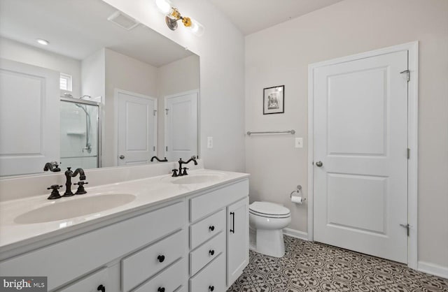 25040 Treeview Ln, Lewes, DE 19958 - full bathroom with double vanity, a stall shower, toilet, and baseboards