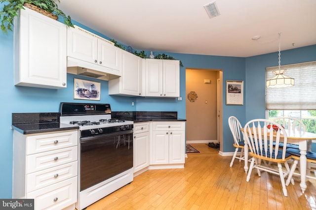 205 Strawberry Ct, Warwick, PA 18974 - kitchen with gas stove, white cabinetry, light wood-type flooring, and baseboards