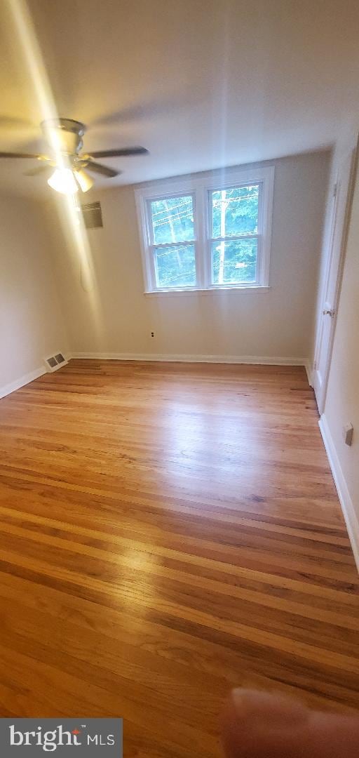 5016 Palmer Mill Rd, Clifton Heights, PA 19018 - empty room featuring light wood-style flooring, plenty of natural light, ceiling fan, and baseboards