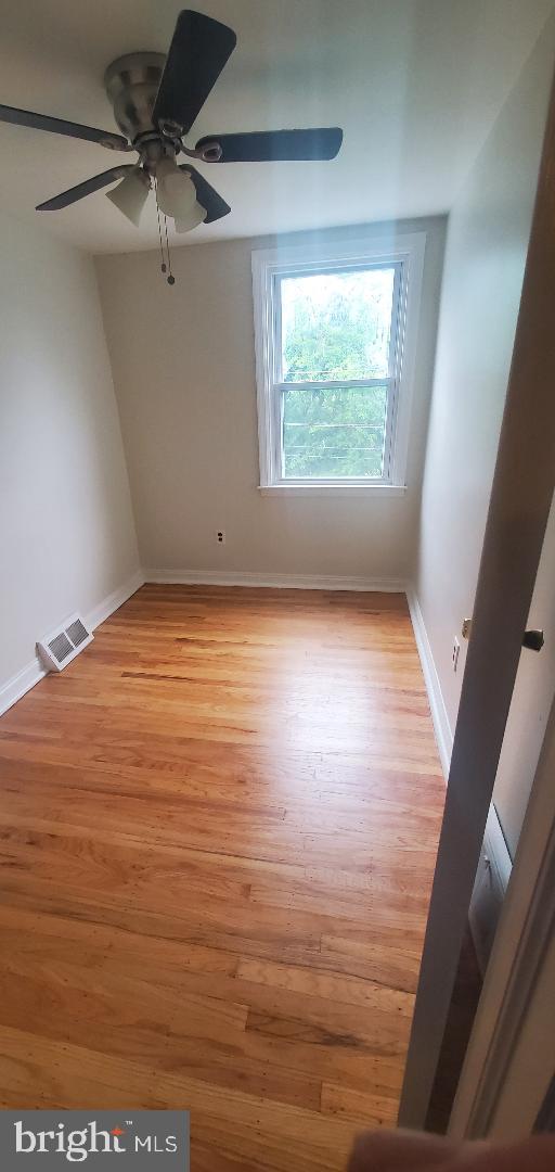 5016 Palmer Mill Rd, Clifton Heights, PA 19018 - unfurnished room with baseboards, ceiling fan, and light wood-type flooring