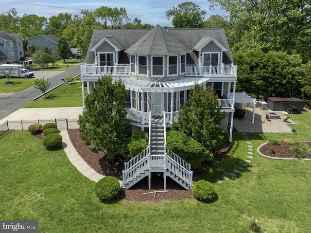 7802 Harbor Rd, Pasadena, MD 21122 - back of house featuring a balcony, stairs, and a jacuzzi