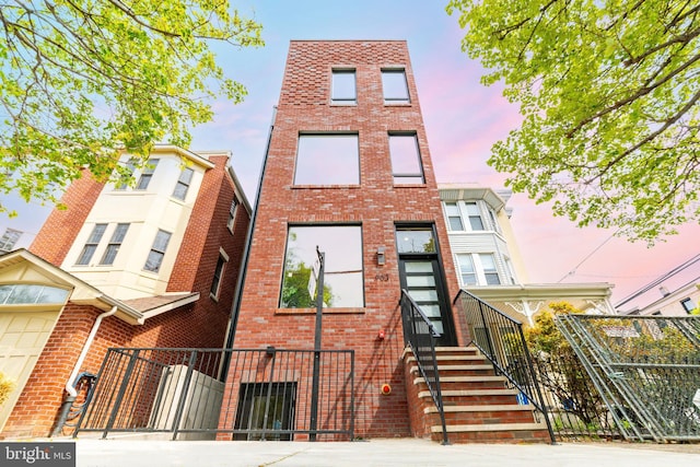 903 Corinthian Ave Unit B, Philadelphia, PA 19130 - view of front of home featuring brick siding and a fenced front yard