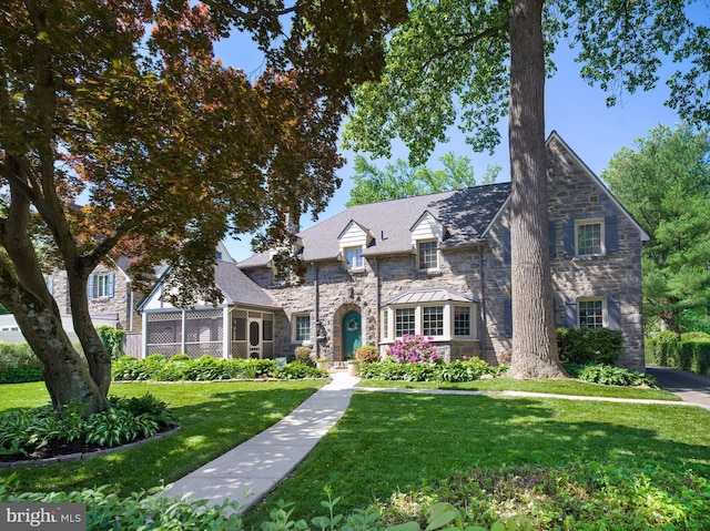 1204 Drexel Ave, Drexel Hill, PA 19026 - tudor home with stone siding and a front lawn