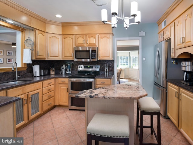 1204 Drexel Ave, Drexel Hill, PA 19026 - kitchen featuring stainless steel appliances, a sink, light brown cabinetry, light tile patterned floors, and decorative backsplash