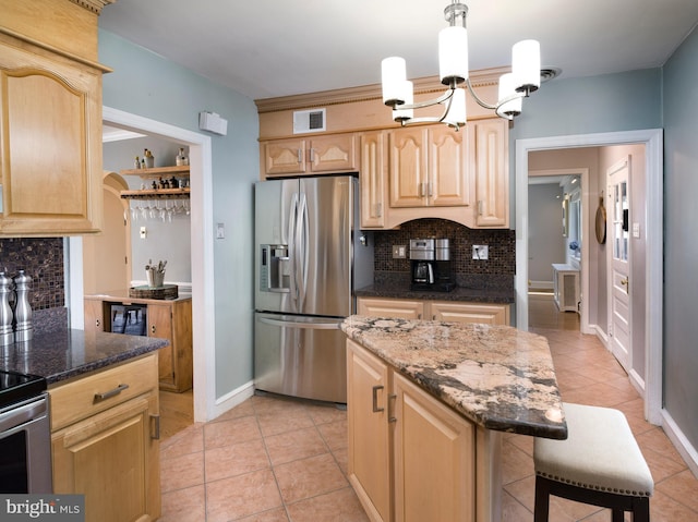 1204 Drexel Ave, Drexel Hill, PA 19026 - kitchen with stainless steel appliances, light brown cabinetry, a chandelier, and tasteful backsplash