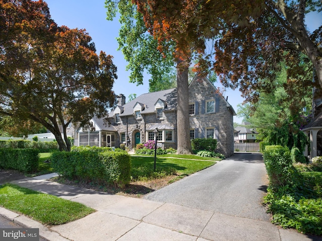 1204 Drexel Ave, Drexel Hill, PA 19026 - view of front of property featuring stone siding, a chimney, and a front lawn