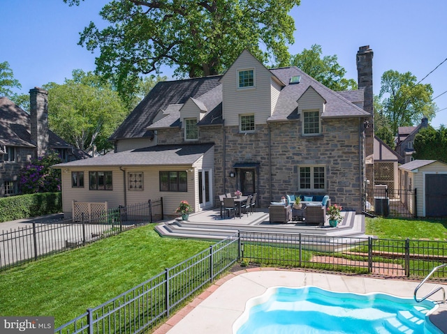 1204 Drexel Ave, Drexel Hill, PA 19026 - back of property featuring stone siding, an outdoor hangout area, a patio area, central AC unit, and a chimney