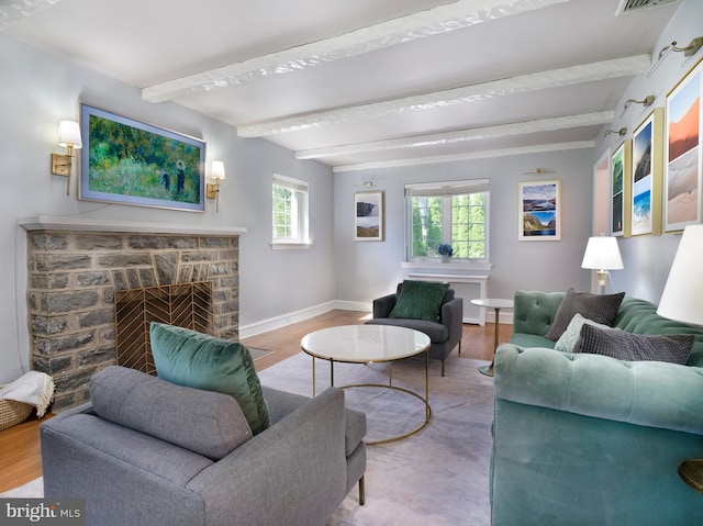 1204 Drexel Ave, Drexel Hill, PA 19026 - living area with baseboards, beamed ceiling, a fireplace with flush hearth, and wood finished floors