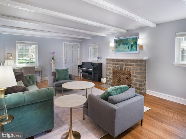1204 Drexel Ave, Drexel Hill, PA 19026 - living room featuring beamed ceiling, baseboards, a fireplace, and wood finished floors