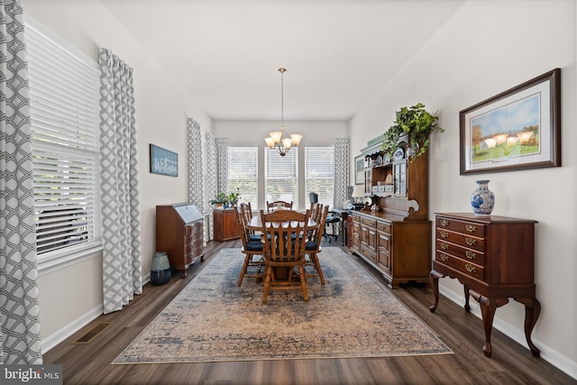 21336 Dauphine St, Lewes, DE 19958 - dining area featuring a chandelier, dark wood-style flooring, healthy amount of natural light, and baseboards