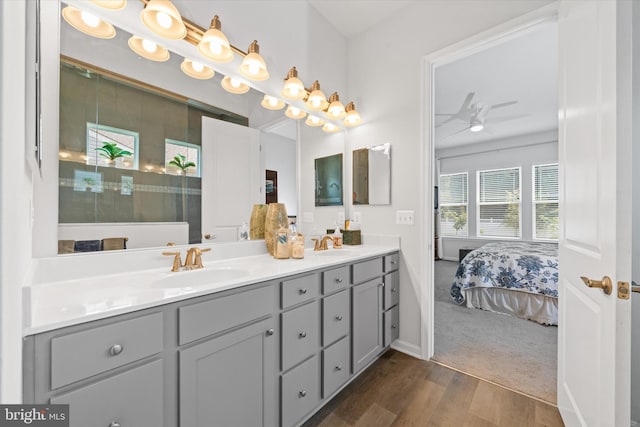 21336 Dauphine St, Lewes, DE 19958 - full bathroom featuring double vanity, wood finished floors, a ceiling fan, a shower, and connected bathroom