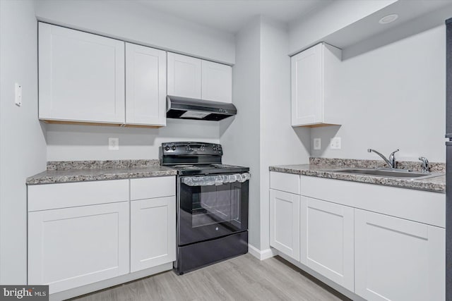 2005 Magnolia Woods Ct Unit 2005-D, Edgewood, MD 21040 - kitchen with black electric range oven, under cabinet range hood, a sink, light wood-style floors, and white cabinets