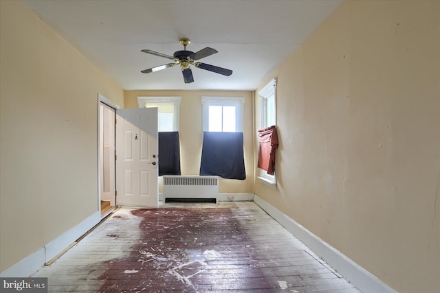 154 S Baltimore St, Dillsburg, PA 17019 - foyer entrance with radiator heating unit, hardwood / wood-style floors, a ceiling fan, and baseboards