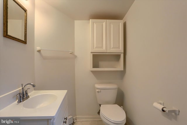 154 S Baltimore St, Dillsburg, PA 17019 - bathroom featuring toilet, vanity, baseboards, and a baseboard heating unit