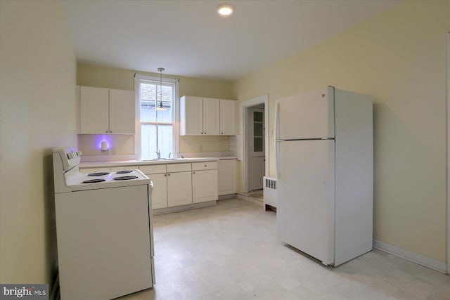154 S Baltimore St, Dillsburg, PA 17019 - kitchen featuring white appliances, radiator, light flooring, and a sink