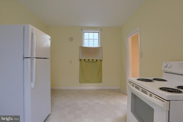 154 S Baltimore St, Dillsburg, PA 17019 - kitchen with white appliances, light floors, and baseboards