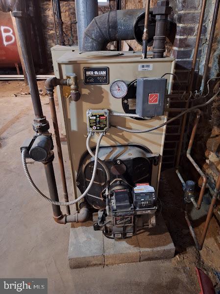 154 S Baltimore St, Dillsburg, PA 17019 - utility room featuring a heating unit