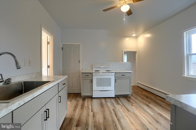 154 S Baltimore St, Dillsburg, PA 17019 - kitchen featuring white electric stove, a sink, a baseboard heating unit, light wood-style floors, and a ceiling fan