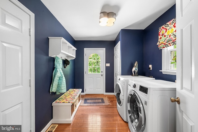 253 Lantern Ln, Gulph Mills, PA 19428 - laundry room with washing machine and clothes dryer, baseboards, and wood finished floors