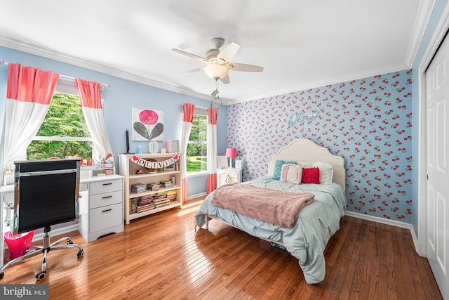 253 Lantern Ln, Gulph Mills, PA 19428 - bedroom featuring wallpapered walls, crown molding, light wood-style flooring, a closet, and a ceiling fan