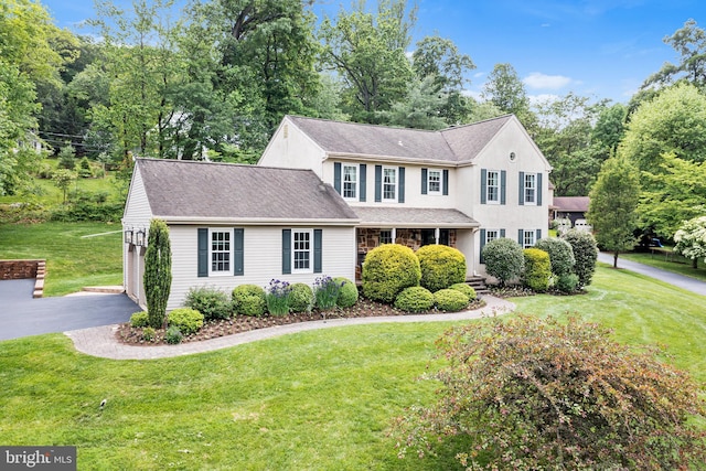 253 Lantern Ln, Gulph Mills, PA 19428 - colonial inspired home with a front lawn and a garage