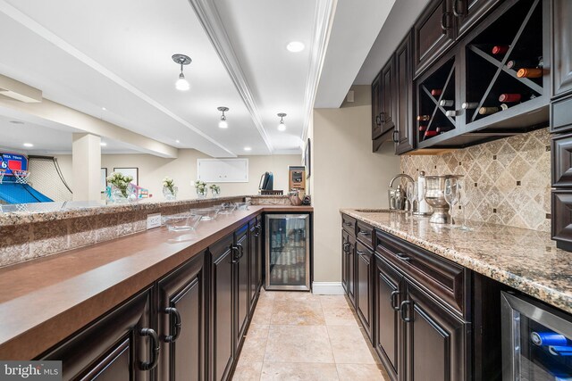 253 Lantern Ln, Gulph Mills, PA 19428 - indoor wet bar with beverage cooler, decorative backsplash, light tile patterned floors, baseboards, and recessed lighting