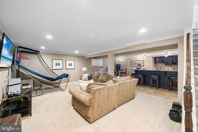 253 Lantern Ln, Gulph Mills, PA 19428 - living area with bar with sink, ornamental molding, and recessed lighting