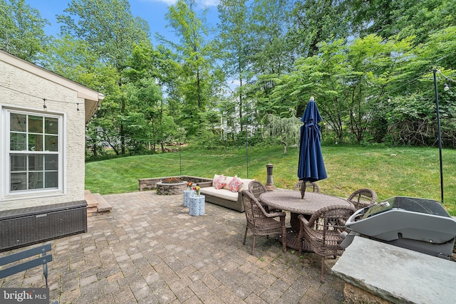 253 Lantern Ln, Gulph Mills, PA 19428 - view of patio with view of scattered trees, area for grilling, and an outdoor living space with a fire pit