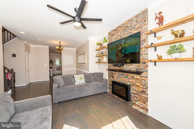 15381 Bronco Way, Woodbridge, VA 22193 - living room featuring wood finished floors, a fireplace, a ceiling fan, crown molding, and baseboards