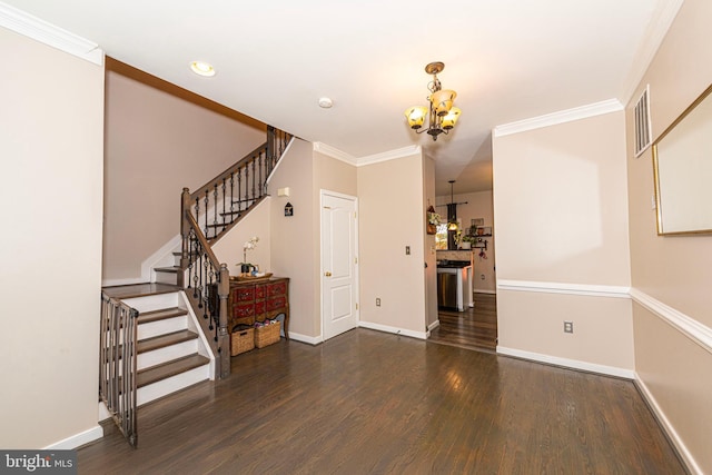 15381 Bronco Way, Woodbridge, VA 22193 - entryway with a chandelier, wood finished floors, stairs, ornamental molding, and baseboards