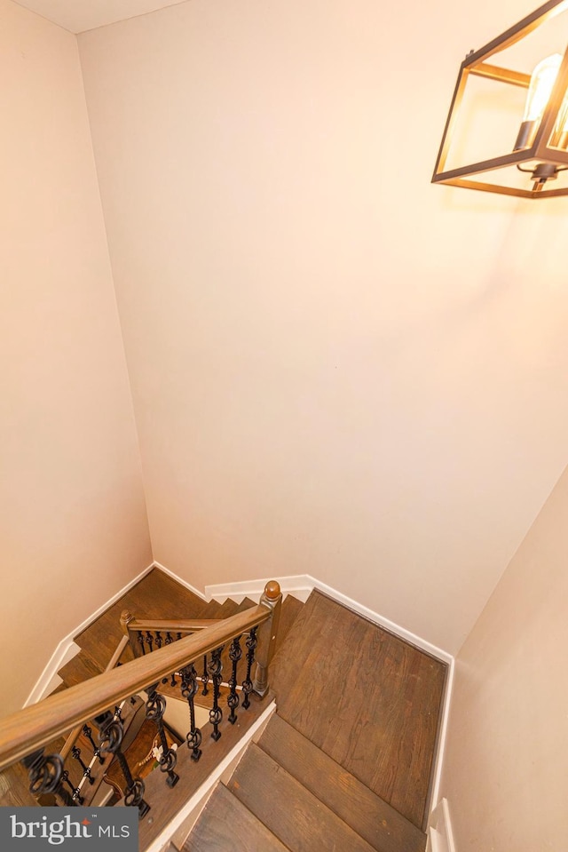 15381 Bronco Way, Woodbridge, VA 22193 - stairway with baseboards and wood finished floors