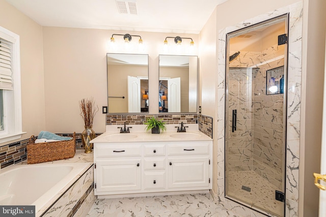 15381 Bronco Way, Woodbridge, VA 22193 - full bath with a bath, a marble finish shower, double vanity, tasteful backsplash, and marble look tiles