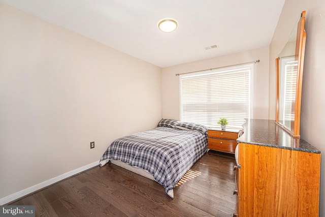 15381 Bronco Way, Woodbridge, VA 22193 - bedroom with dark wood-style flooring and baseboards