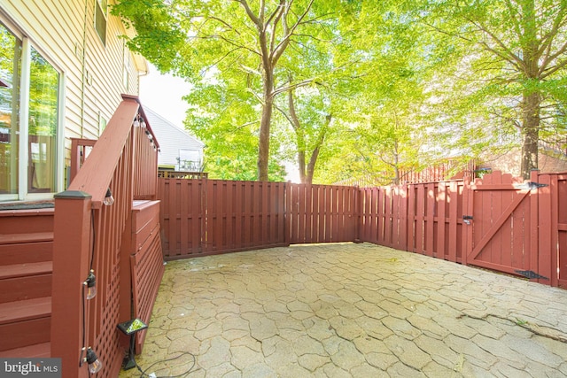 15381 Bronco Way, Woodbridge, VA 22193 - fenced backyard featuring a gate and a patio