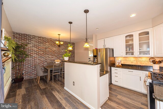 15381 Bronco Way, Woodbridge, VA 22193 - kitchen featuring appliances with stainless steel finishes, brick wall, dark wood-style floors, glass insert cabinets, and white cabinets