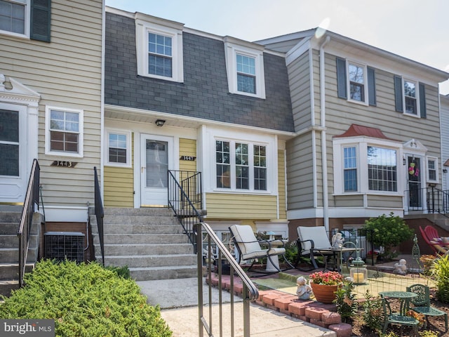 1447 Chatham Ct, Crofton, MD 21114 - view of property with roof with shingles, cooling unit, mansard roof, and entry steps